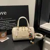 Bolso Pequeño de Hombro Estilo Fragancia con Patrón de Tejido de Nicho para Mujer 2026 Nuevo Bolso Cruzado Simple Versátil Bolso de Mano de Alta Gama
