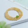 Pulsera de Jade Dorado de tres colores con dos anillos al por mayor para mujer Pulsera de Flor de Campanilla Blanca de Jade Dorado pulsera de anillos múltiples con cuentas amarillas