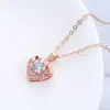 Un conjunto de pendientes collar anillo de corazón de melocotón chapados en oro con circonita microincrustada de material de cobre conjunto de cuatro piezas de joyería de comercio europeo y americano