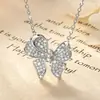 Lindo collar con colgante de moissanita en forma de lazo totalmente adornado para mujer, deslumbrante cadena para la clavícula de diseño único, popular en Xiaohongshu