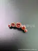 F136/G23 Aleación de Titanio Cinco Enlaces Circonio Joyería para Perforaciones Pendientes de Aleación de Titanio Clavos para Labios Clavos para Hueso de Oreja Venta al por Mayor