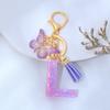 Llavero de Resina con Lentejuelas Moradas con Letra Inglesa Colgante para Bolso de Niña Borla de Mariposa Accesorios Explosiones Transfronterizas