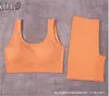 Conjunto deportivo de dos piezas para mujer, transfronterizo al por mayor, europeo y americano, simple, sin costuras, con almohadilla en el pecho, red explosiva, color rojo, chaleco y pantalones cortos tipo bóxer.