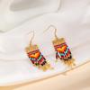 Pendientes de borlas largas exageradas de estilo étnico retro europeo y americano bohemio, pendientes de cuentas de arroz Yuxing importados, hechos a mano