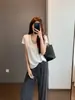 Senso de design Malha elástica Botão de osso Costura dupla Camada dupla Decote U Cor contrastante Falso conjunto de duas peças Manga curta Camiseta Verão H070403