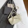 Bolso de hombro moderno y sencillo, nuevo bolso de mano para el verano de 2026, bolso tipo cubo informal de tendencia estilo coreano para mujer