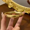 Nuevo Pulsera Espléndida de Esmalte Estilo Corte Dorado Patrón Ruyi Ramas Envueltas Esmalte Hueco Pulsera Antigua Vintage