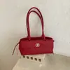 2026 nova moda transfronteiriça bolsa tipo travesseiro simples bolsa de ombro casual coreana para mulheres bolsa de mão com textura de luxo leve