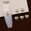 Nuevos accesorios de aleación para decoración de uñas con forma de corazón torcido tridimensional liso con diseño de amor hueco retro japonés