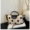 2026 Verano Nuevo Simple Bolso de Hombro con Lunares y Forma de Dumpling para Mujer Moda Versátil de un Solo Hombro Cruzado para el Trabajo Bolso Simple para Mujer