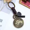 Llavero Unisex Versátil Creativo de los Doce Signos del Zodiaco con Patrón Personalizado Símbolos Colgante Decorativo de Doble Capa Accesorio