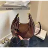 Bolso de axila tipo 'dumpling' de nicho francés de alta gama transfronterizo para mujer, nuevo bolso de mano de moda, bolso de hombro versátil de estilo extranjero