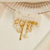 Aretes de acero de titanio chapados en oro para mujer, aretes de alta gama que no se desvanecen, aretes asimétricos vintage, aretes transfronterizos, aretes de estrellas