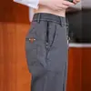 Pantalones casuales de negocios para hombre, nuevos estilos otoño/invierno, con bolsillos con cremallera, versátiles para primavera, corte holgado, pierna recta, pantalones largos