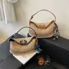 Moda de Verano 2026 Bolso Cubo Rayado Versátil de Moda de Gama Alta Bolso de Hombro Bolso de Mano Simple Bolso Cruzado para Mujer