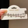 Pulseira de zircônia em formato de cruz da moda para mulheres, nicho de luxo leve, joias versáteis de alta moda, atacado