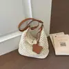 Bolsa de ombro feminina grande capacidade estilo coreano trançada transfronteiriça nova moda 2026 versátil estilo casual de férias bolsa de praia