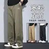 Estilo novo de primavera, algodão puro bordado, ligeiramente solto, casual, lavado, roupa de trabalho, calça de pai com punhos ajustáveis, marca moderna estilo americano