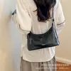 Bolso de mujer de gran capacidad 2026 nuevo estilo bolso cruzado bolso de mujer ins retro moda color sólido bolso de hombro para axila para mujer
