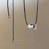 Collar con colgante de perla y lazo para mujer, estilo retro, otoño e invierno, largo, de lana, con cadena, nicho, accesorios de cuerda de cuero de alta gama.