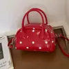 Bolso de mano para mujer modelo nuevo 2026 transfronterizo, bolso cruzado simple de nicho, bolso de hombro de moda con lunares lindos
