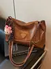 Ropa de Trabajo de Comercio Exterior Bolsa de Gran Capacidad para Mujer Moda Otoño e Invierno 2025 Bolso Tote Versátil Bolso de Hombro con Cadena Retro