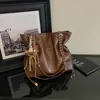 Bolsa Feminina 2026 Outono Novo Modelo Uso Diário Deslocamento Cor Sólida Simples Nicho Estiloso Grande Capacidade Bolsa de Ombro com Corrente