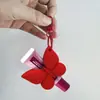 Novo Produto Transfronteiriço: Suporte de Silicone para Batom e Gloss, Suporte Portátil com Clipe para Protetor Labial e Gloss, Chaveiro