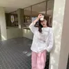 Nueva camiseta de algodón puro de manga larga estilo coreano súper popular para mujer, con estampado elegante, top casual holgado de longitud media