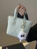 Bolso pequeño popular de este año para mujer 2025 primavera nueva moda bolso bandolera de hombro tendencia de textura bolso de cubo portátil