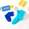 Venta directa de fábrica de calcetines de primavera con explosiones de colores sólidos japoneses de color caramelo para mujer, calcetines de colores de marea, venta al por mayor