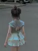 Roupa Infantil 2025 Verão Estilo Coreano Moda Feminina Camiseta com Recorte nas Costas e Nó Manga Curta Doce Saia Plissada Curta
