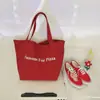 Moda 2025 Nova Bolsa Tote de Ombro com Letras Vermelhas Casual Estudante Nicho Comutador Grande Capacidade Bolsa de Lona