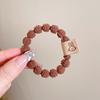 Corda de cabelo de outono e inverno elástico de borracha alta elasticidade durável não machuca o cabelo temperamento simples cabeça de bola corda de cabelo infantil acessório de cabelo feminino