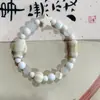 Fabricantes suministro pulsera de cachorros de cerámica diseño de nicho pulsera nuevo chino lindo cachorros huesos cuentas juguetonas