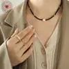 Collar de cuentas de vidrio negro con personalidad y temperamento de moda, colgante de perlas de agua dulce, joyería sexy, diseño original de nicho.