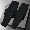 Calças masculinas para primavera e outono, calças casuais da moda com bolsos com zíper, calças esportivas jogger retas largas