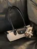 Bolsa baguette de camurça vintage de alta qualidade para mulheres, nova bolsa de ombro/axila de moda de nicho 2026, bolsa de mão para o dia a dia
