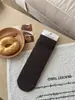 Calcetines gruesos de estilo francés retro para principios de otoño con patrón de diamantes huecos sin costuras para mujer, algodón absorbente de sudor y transpirable, se pueden usar solos o apilados como calcetines de media pantorrilla