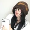 Gorro de punto con lazo retro estilo coreano OuiPack para mujer, cálido y resistente al frío para otoño e invierno, que cubre las orejas