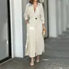 Ropa de mujer transfronteriza europea y americana 2026: vestido largo simple y casual con cuello de solapa, bolsillos y un cinturón