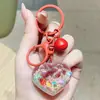 Llavero de Corazón Mini Relleno de Aceite de Dibujos Animados con Botella de Arena Líquida, Colgante de Dibujos Animados para Estudiantes y Niños, Pequeño Regalo Estilo Ins al por Mayor