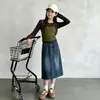 Conjunto de Primavera y Otoño para Niñas 2026 Nuevo Casual Estilo Coreano Niños Medianos y Grandes Falso Dos Piezas Manga Larga Falda de Mezclilla a Mitad de Pierna Moderno