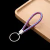 Llavero de cuerda de cuero colgante para coche accesorios cuerda de llave de cuerda de cuero tejido pu para empujar pequeño regalo fabricantes al por mayor