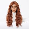 Europa y Estados Unidos peluca al por mayor para mujer naranja cabello largo rizado ondas grandes flequillo ordenado simulación transpirable cobertura completa de cabeza fabricantes en stock