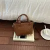 Bolsa de mão pequena super popular para mulheres, novo modelo de verão 2026, bolsa de ombro tipo balde nichada de alta qualidade para o dia a dia