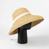 Nuevo sombrero de paja con lazo de rafia de verano europeo y americano, sombrero de playa sencillo a la moda para viajes al aire libre y protección solar.
