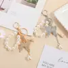 Llavero de Cadena de Perlas de Aleación con Diamantes Completos de Mariposa Grande Transfronterizo Europeo y Americano Llavero Exquisito para Bolsa Estilo K Exquisito