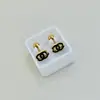 Aretes Mini Gota de Aceite Dorados de Acero de Titanio en Caja Aretes Sencillos de Tornillo Cuatro Hojas Pendientes de Marca Grande