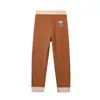 Leggings térmicos para niños otoño e invierno 2026 color caramelo cepillado elástico base leggings para niños y niñas pantalones para dormir en casa
